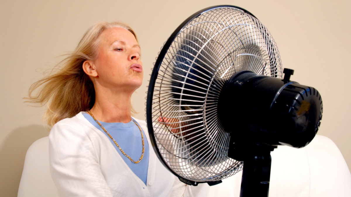 Older woman having a hot flush