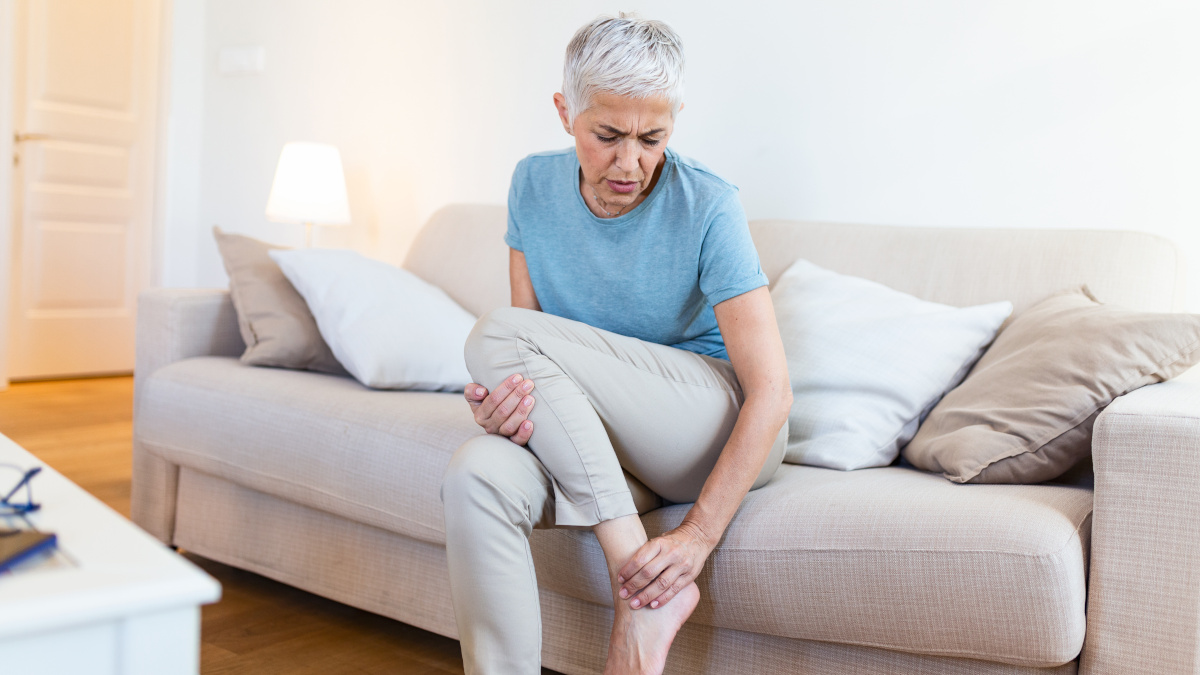 Elderly woman suffering from osteoporosis