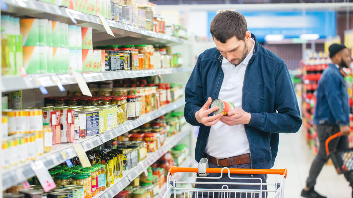 Man reading a product’s nutritional details